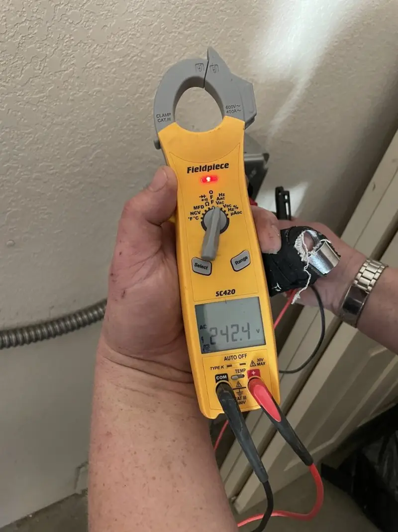 Voltage testing with clamp meter during Electrical Installation Services in Sunnyside